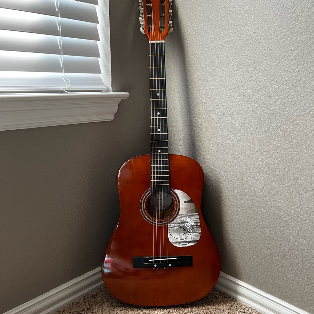 Acoustic guitar signed by taylor swift